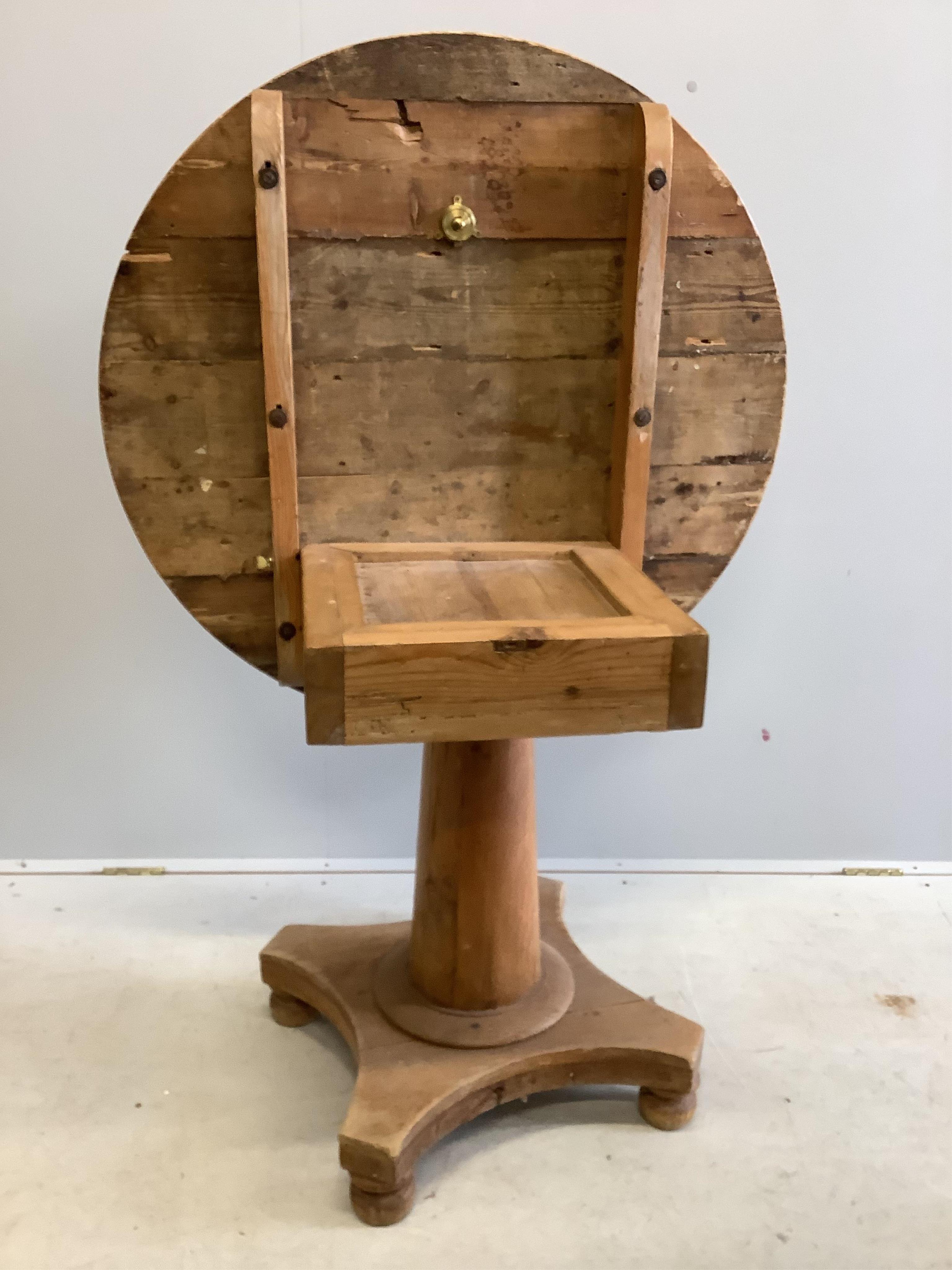 A 19th century Continental pine circular tilt top breakfast table, diameter 92cm, height 72cm. Condition - fair